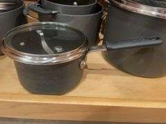 Kitchen drawer w/ mostly pots & lids