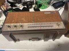 Suitcase, camera with bag, antique General Electric speaker, tin, and more