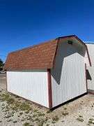 10x14 White and red storage barn - contents not included