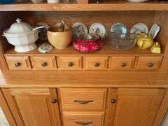 Shelf of glassware - plates, bowls, and more