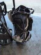 Wilson Staff golf bag and Sun Mountain bag carrier