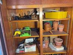 (3) shelves of gardening items including planters, sprinklers, small hose & more