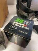 Suitcase, camera with bag, antique General Electric speaker, tin, and more