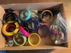 Flat of costume jewelry - mostly bracelets and earrings, and jewelry cleaner