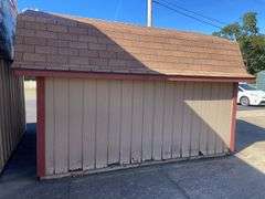 10x12 tan and red storage barn - contents not included