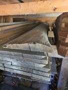 Assortment of stacked lumber. Under roof, lots of 8ft & 10ft variety of species Buyer responsible fo