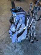 Wilson Staff golf bag and Sun Mountain bag carrier