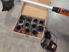 Black and Decker electric trimmer with charger and extra line/caps