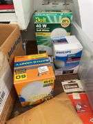 Contents of shelving including lightbulbs, screw-in hooks & more