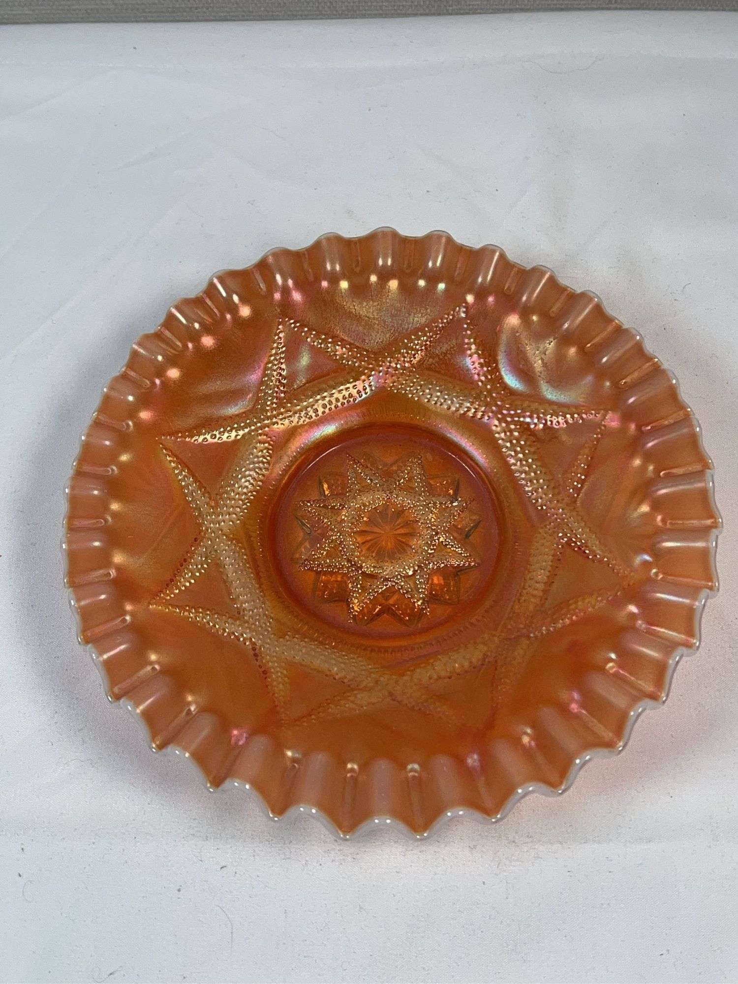Dugan Ski Star peach opalescent carnival glass bowl.
