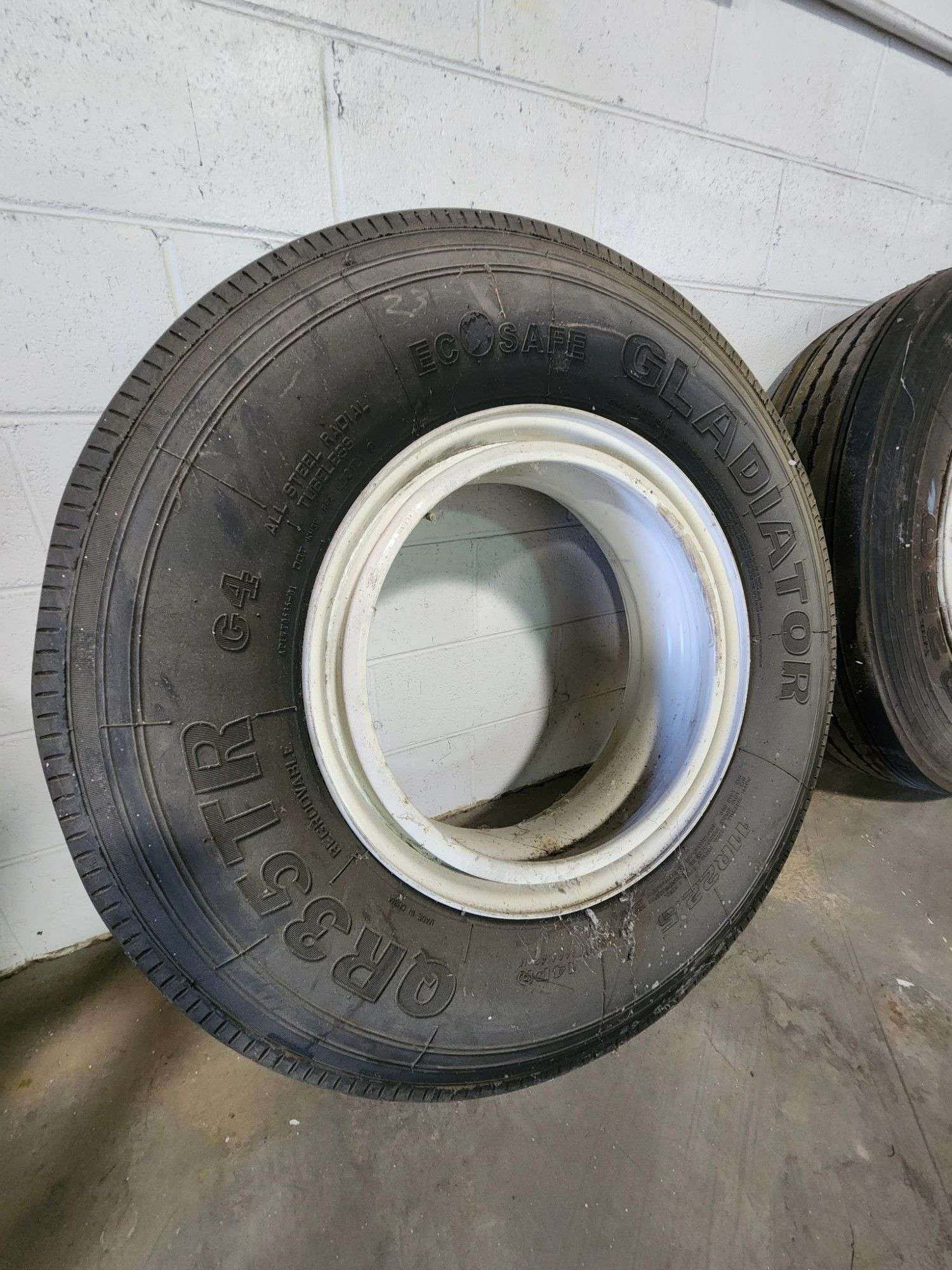 WHEEL AND TIRE 11R 22.5 - Kaufman Realty & Auctions