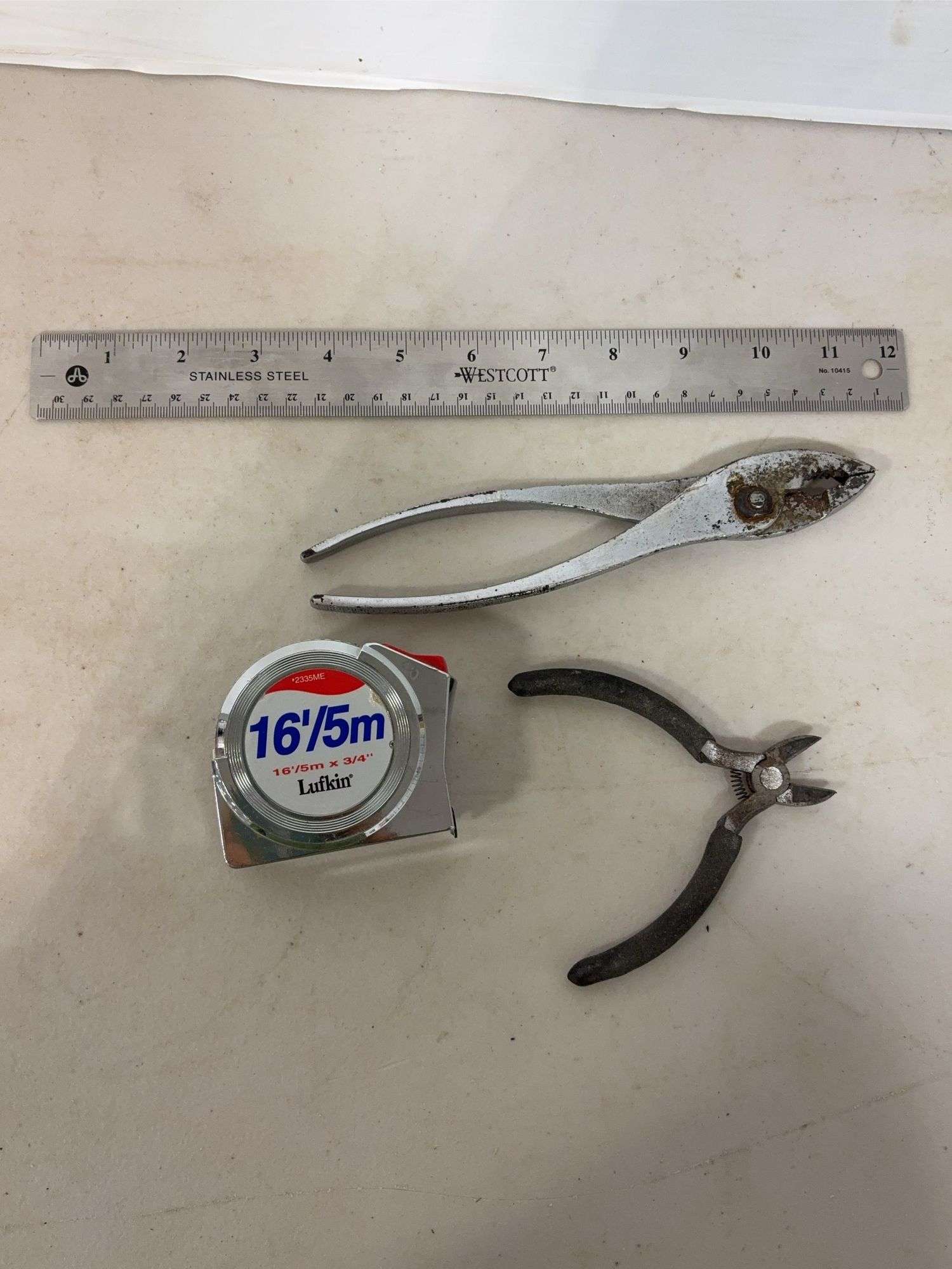 Flat of tools including ruler, hammers, tape measure & more