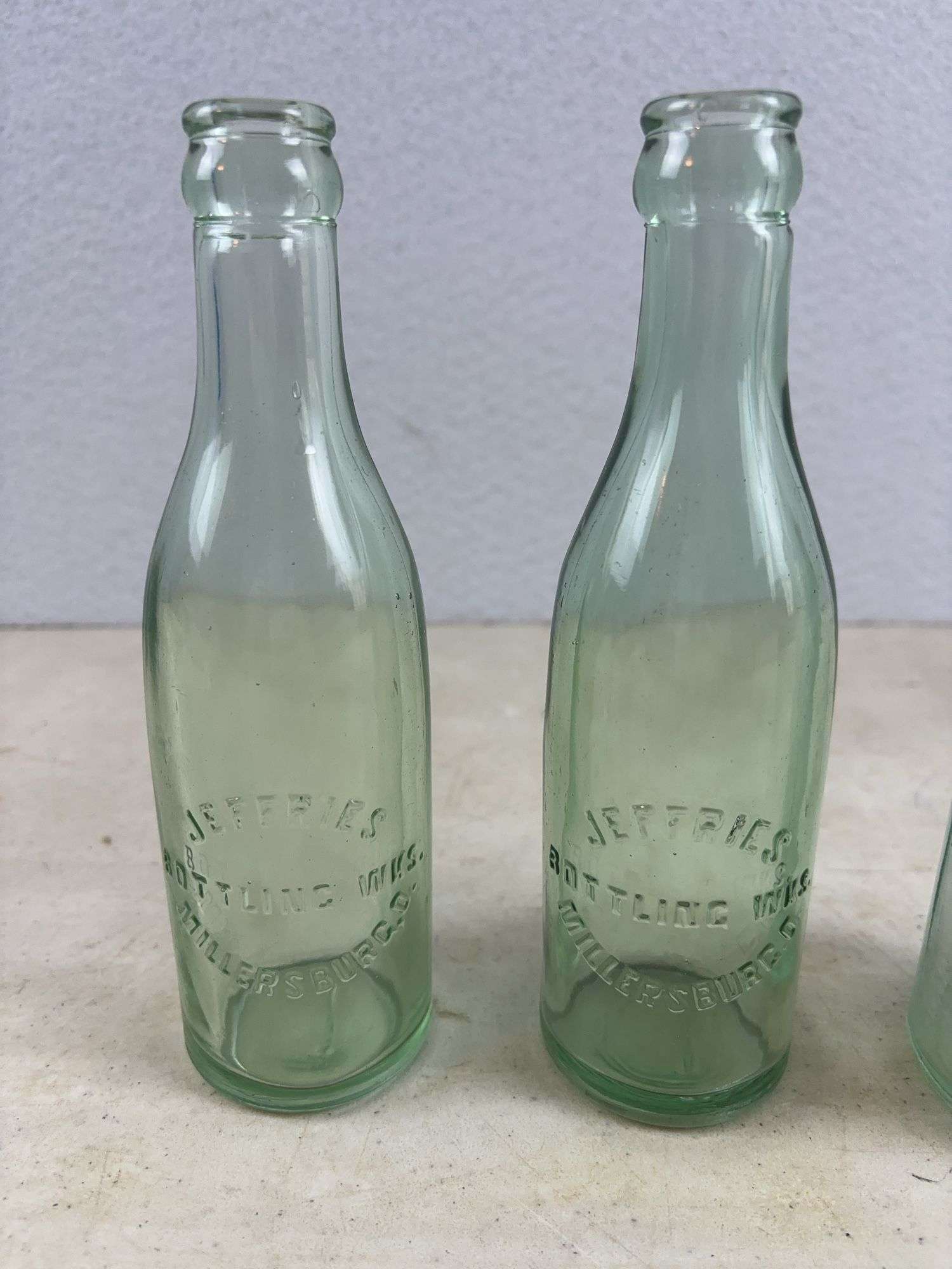 2 Jeffries Millersburg glass bottles and Akron brewing co. bottle
