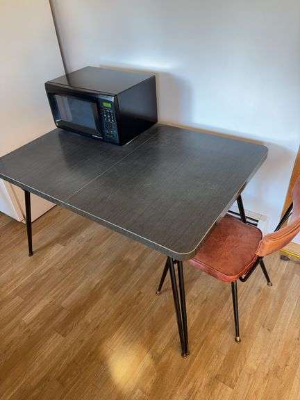 Table And One Chair 35”d x 50”w x 29”h (microwave not included)