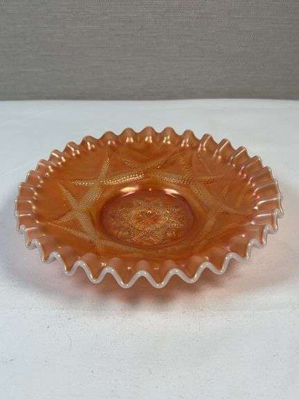 Dugan Ski Star peach opalescent carnival glass bowl.