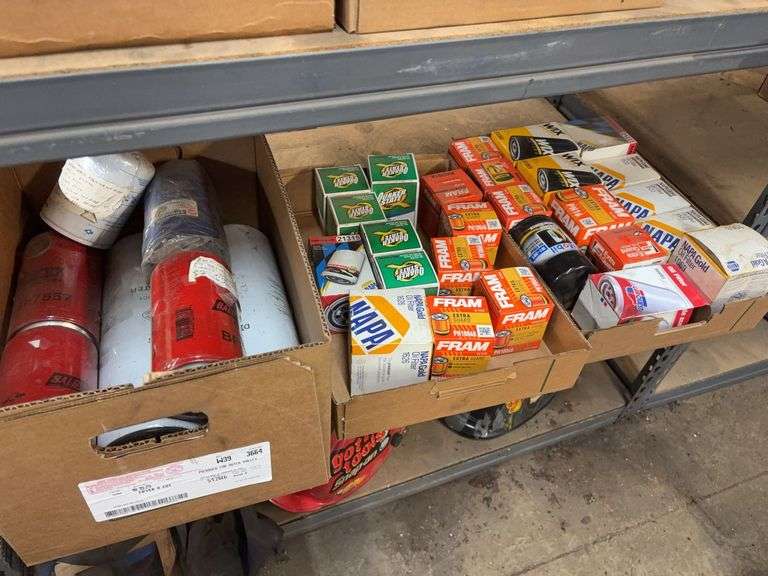 Contents of shelf including various types of oil filters