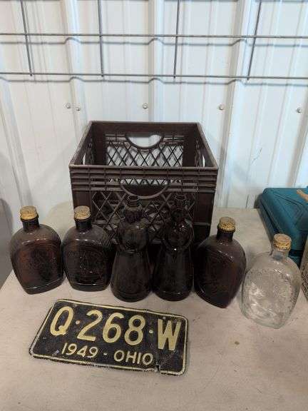 Vintage glass bottles - possibly Aunt Jemima, Borden mill crate, and 1949 Ohio license plate