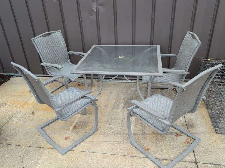 Outdoor patio table with (4) chairs - some chairs ripped - glass top table - 45" x 45" x 28" tall