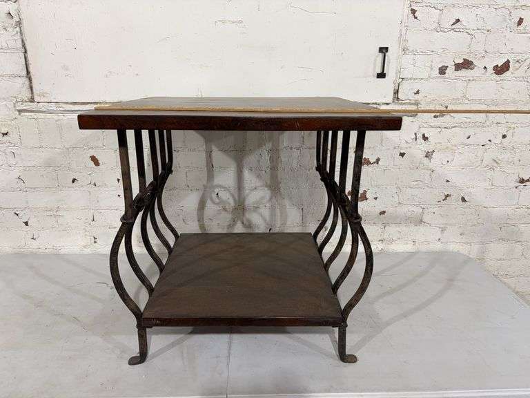 24” W x 23 1/2” L x 23 1/2” H End table with cast-iron base 