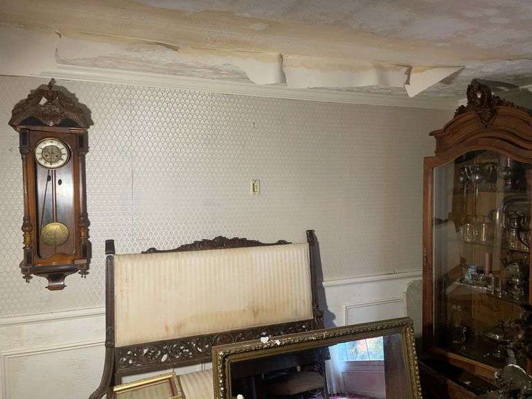 Upholstered bench, wall clock, mirror, stand with contents, and more