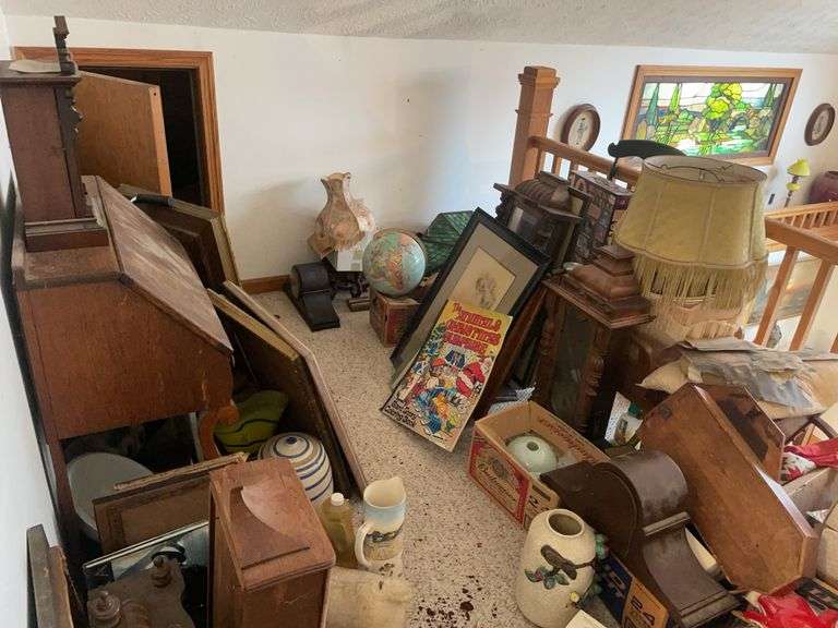 Framed pictures, desk, clocks, globes, and more