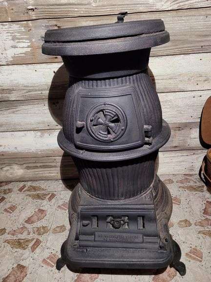 CAST IRON POT BELLY STOVE- very heavy- in basement