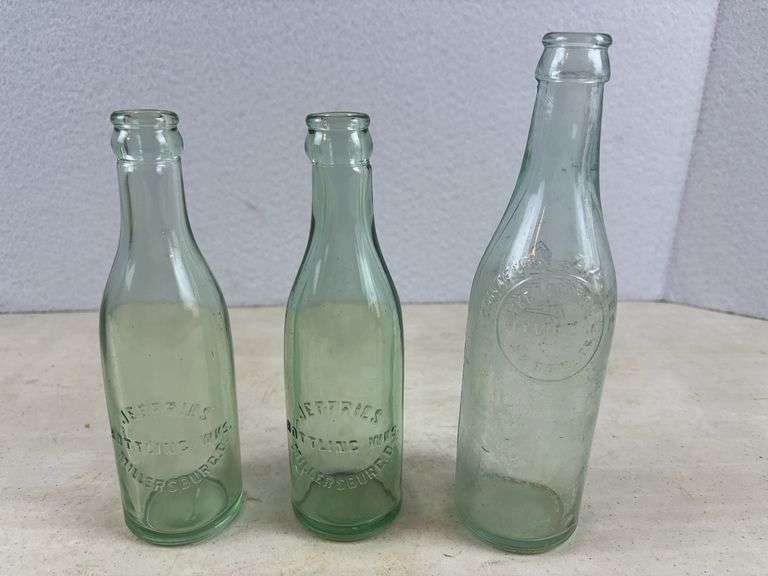 2 Jeffries Millersburg glass bottles and Akron brewing co. bottle