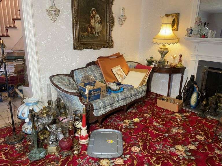Antique clawfoot couch, lamps, framed photo, miscellaneous glassware, and more