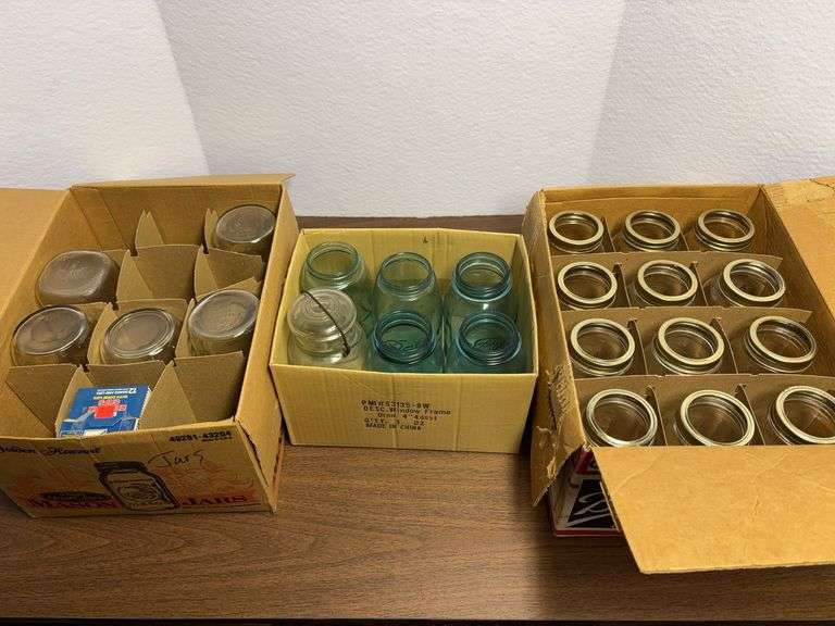 3 boxes of jars and lids