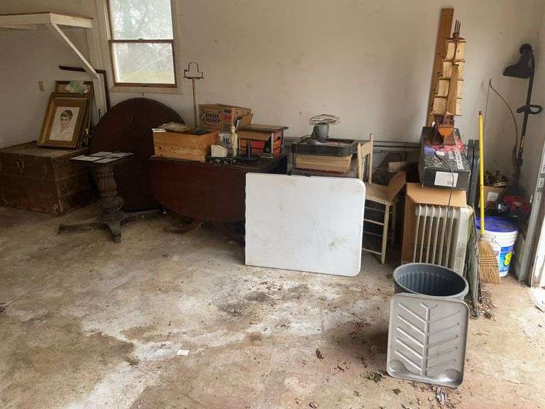 Weed eater, foldable tables, antique tables, chest, extension ladder, framed photos, and more