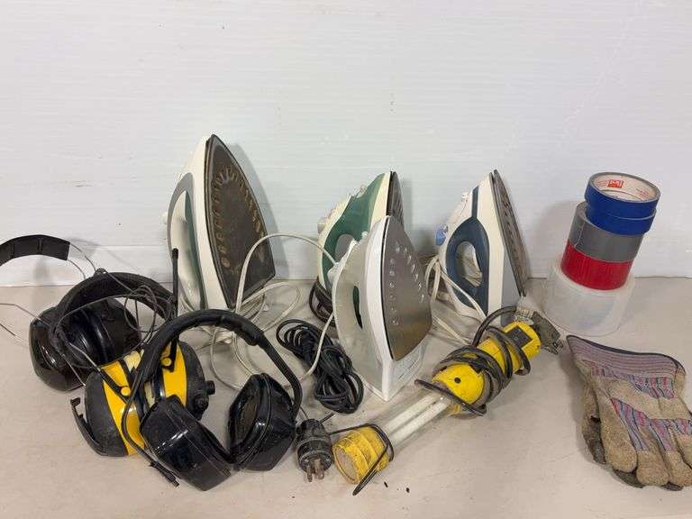 Box of irons, misc. tape, headphones & misc.
