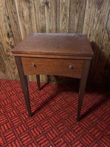 Sewing machine and cabinet