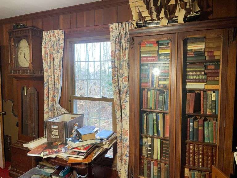 Cabinet, grandfather clock, framed photos, stand, books, and more