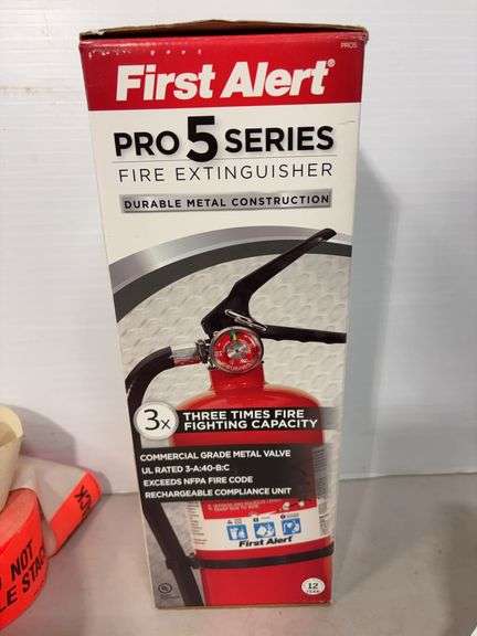 Lot of shop supplies including scotch tape dispenser, fire extinguisher, paint suits and more