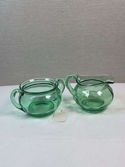 PAIR OF GREEN GLASS HEISEY CREAM AND SUGARS. NO LIDS
