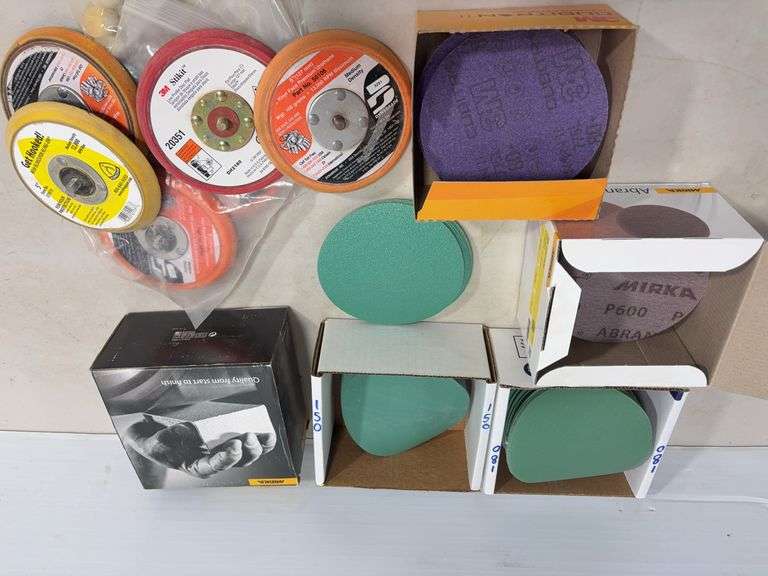 Flat of palm sander discs of various grits
