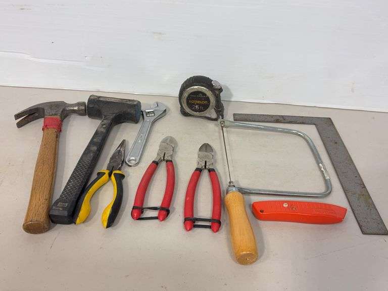 Flat of tools including T-square, hammer, mallet, tape measure, wire cutters and more