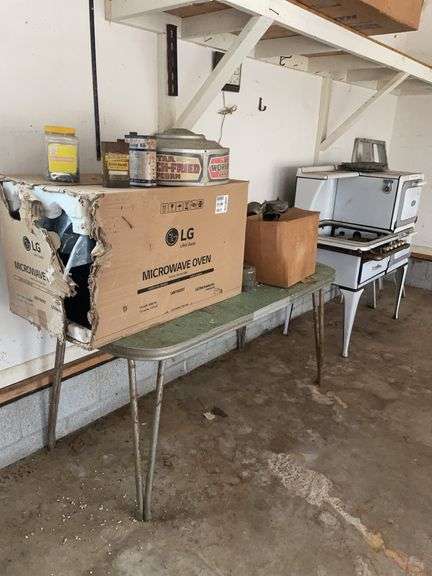 LG microwave in box, White Star stove, ladder, and more