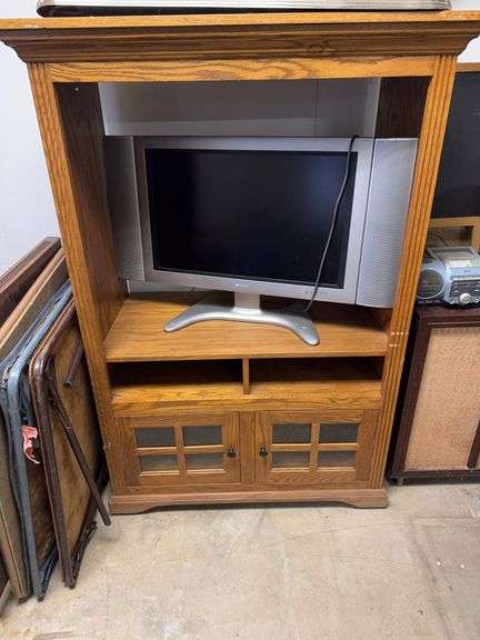 Sharp Monitor and a TV and Entertainment Console 61” H 39” W 21” D