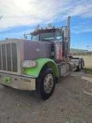 2015 Peterbilt 389 showing 53,258 mi, 8,978 hrs- runs