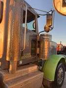 2015 Peterbilt 389 showing 53,258 mi, 8,978 hrs- runs