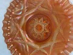 Dugan Ski Star peach opalescent carnival glass bowl.