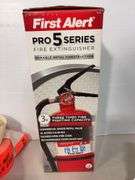 Lot of shop supplies including scotch tape dispenser, fire extinguisher, paint suits and more