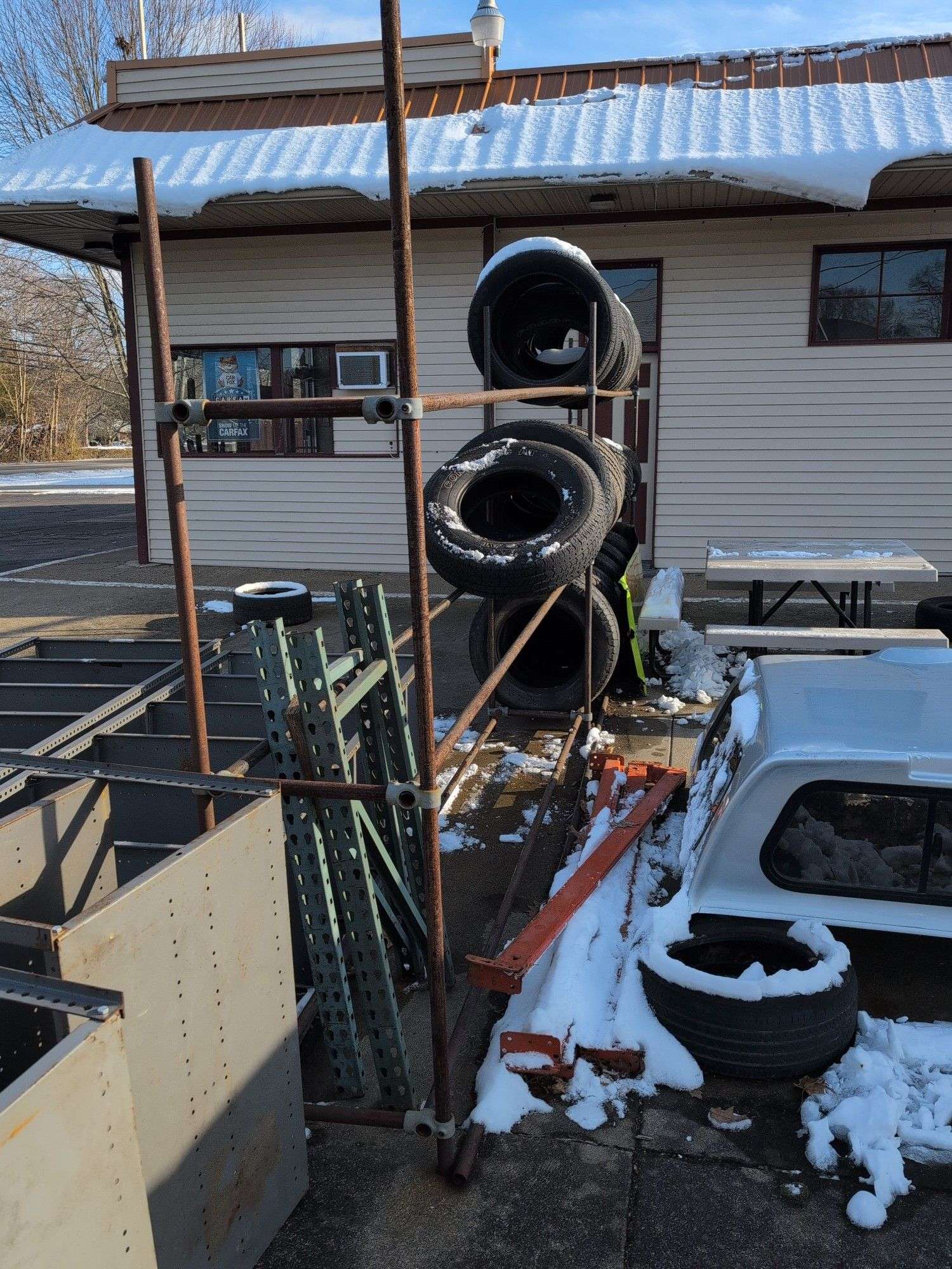 Metal tire rack - 21' x 18" x 7' - stored outside, contents not included