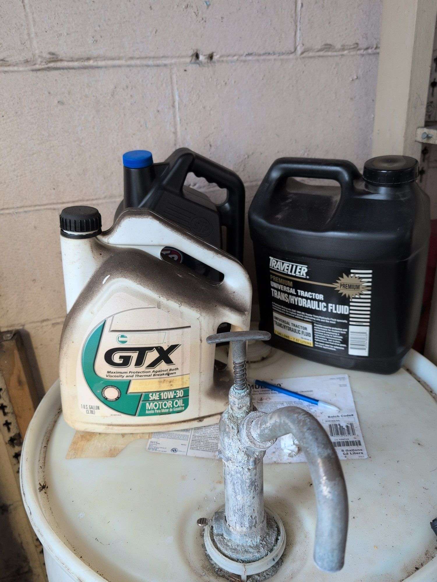 Assortment of motor oil and other vehicle fluids - most partially full