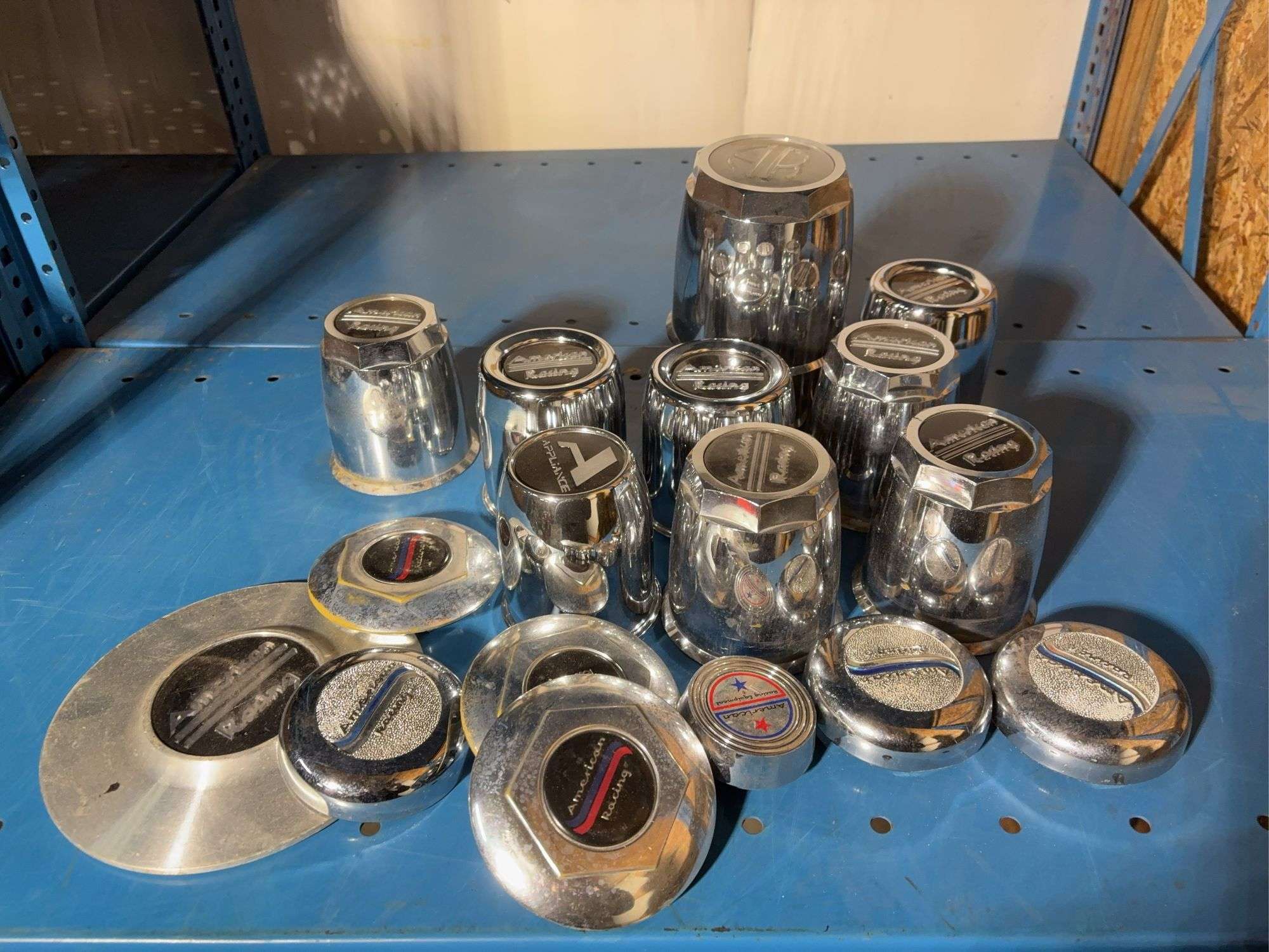 Box of American racing hubcap covers