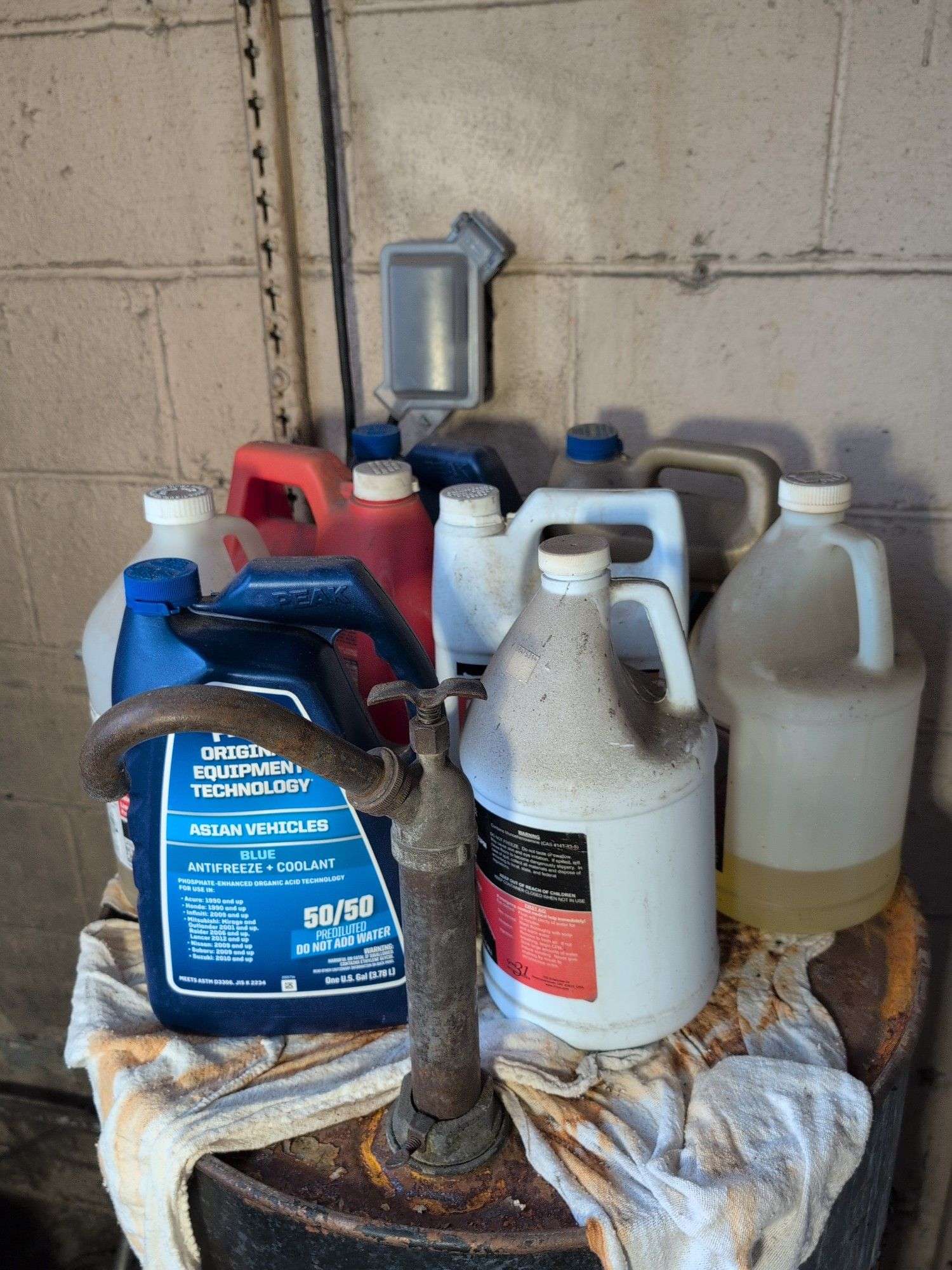 Assortment of motor oil and other vehicle fluids - most partially full