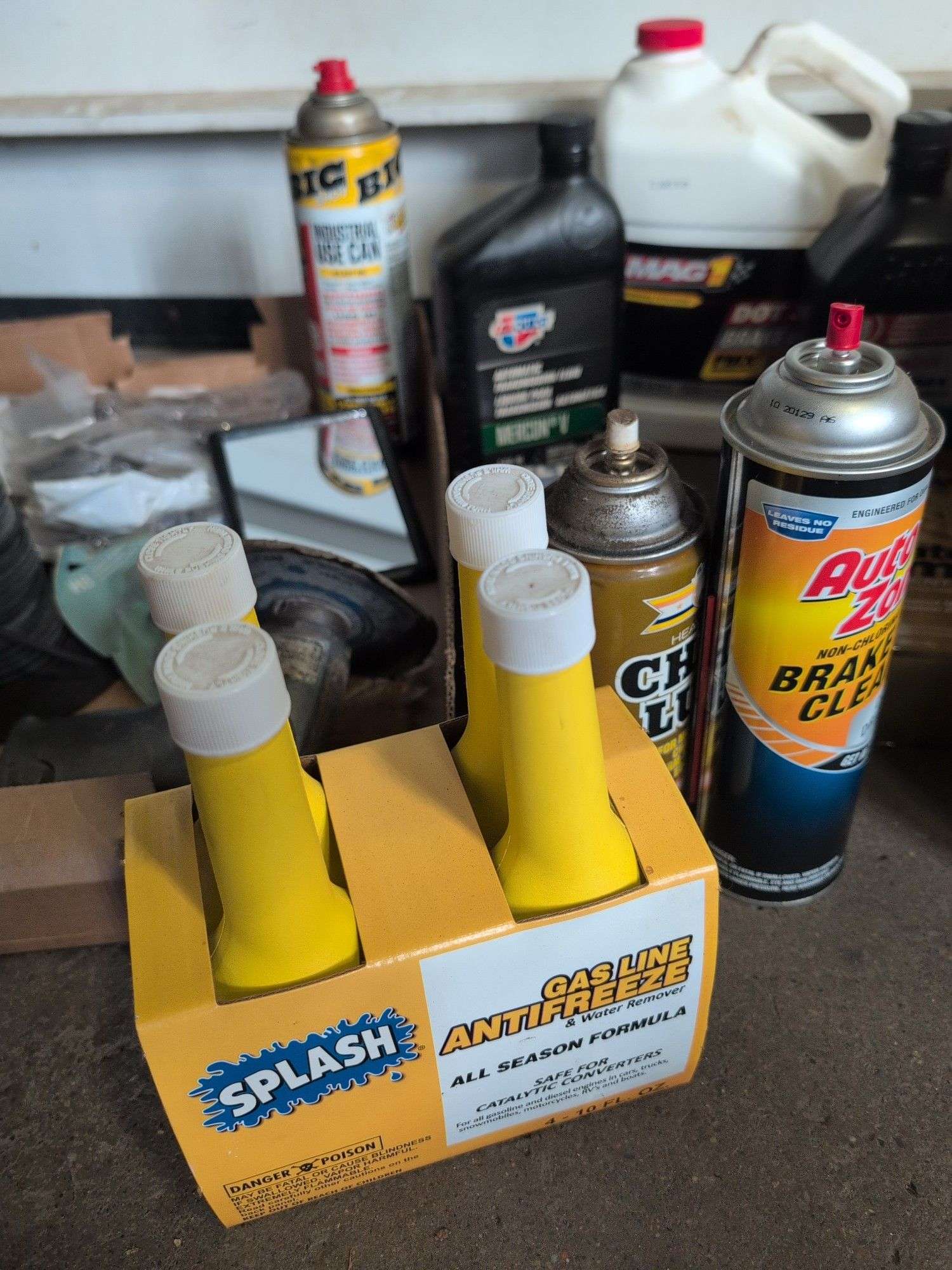 Assortment of mechanic fluids and some tools