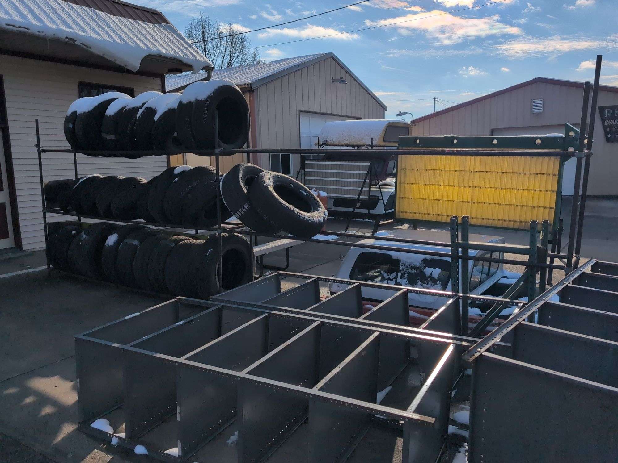 Metal tire rack - 21' x 18" x 7' - stored outside, contents not included