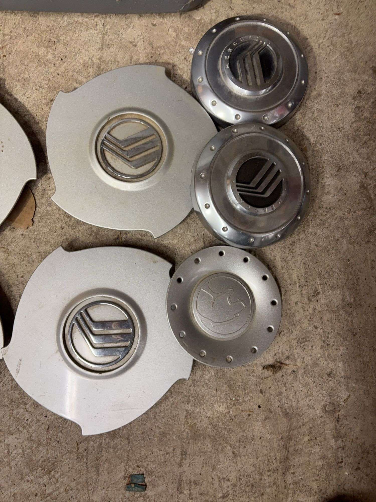 Tote of Miscellaneous hub caps and parts -see photos